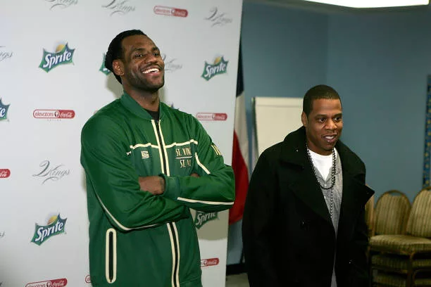 Superstar LeBron James and producer/rapper Shawn "Jay-Z" Carter speak to reporters before meeting with kids at the Dallas Boys & Girls Club on...